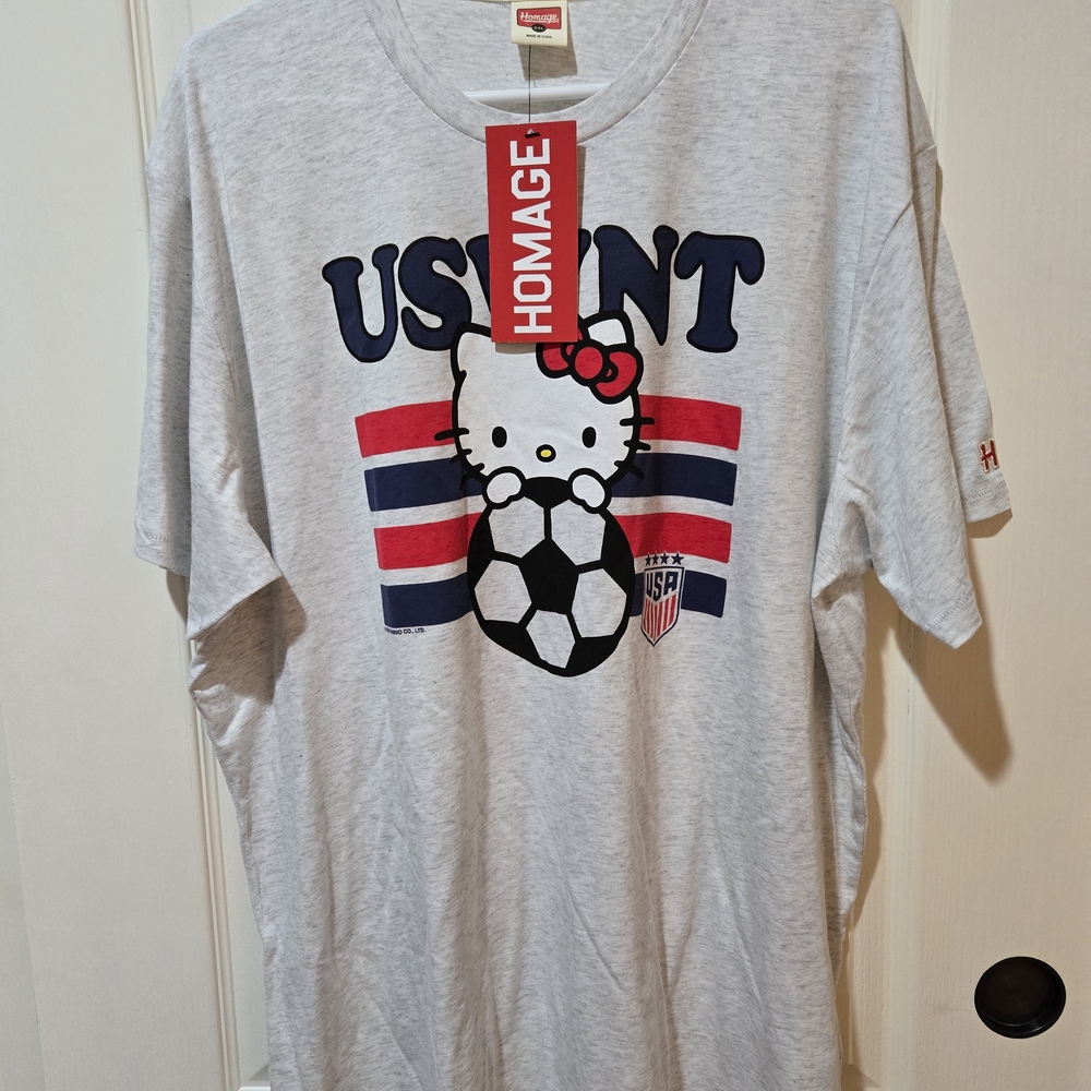 HOMAGE Light Gray Hello Kitty USA Soccer Graphic Tee with Navy & Red Accents
